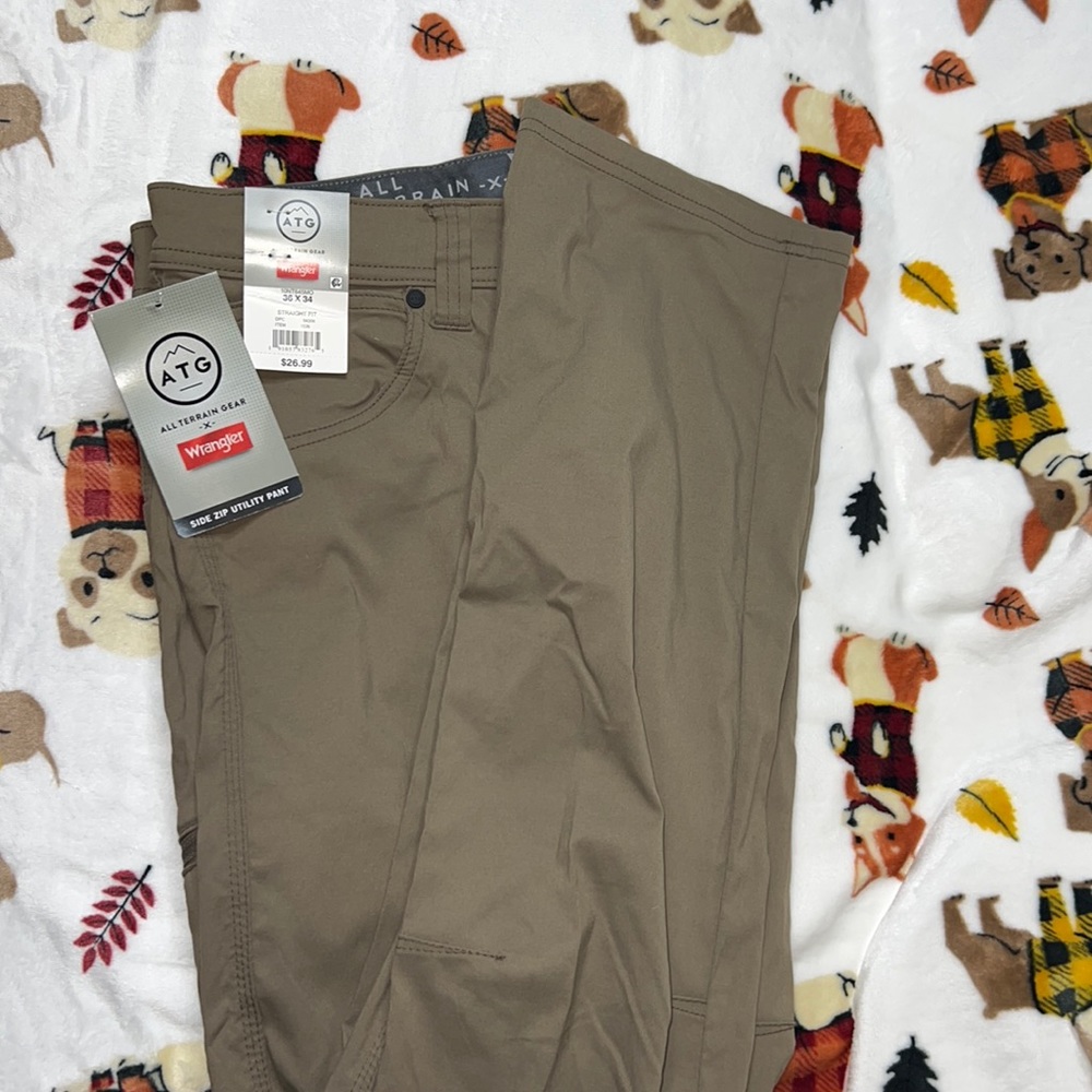 Brand new men wrangler work pants .